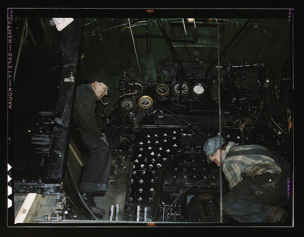 Working on the cab of a locomotive brought in for repair at the C & NW RR 40th Street shops, Chicago, Ill.  (LOC)