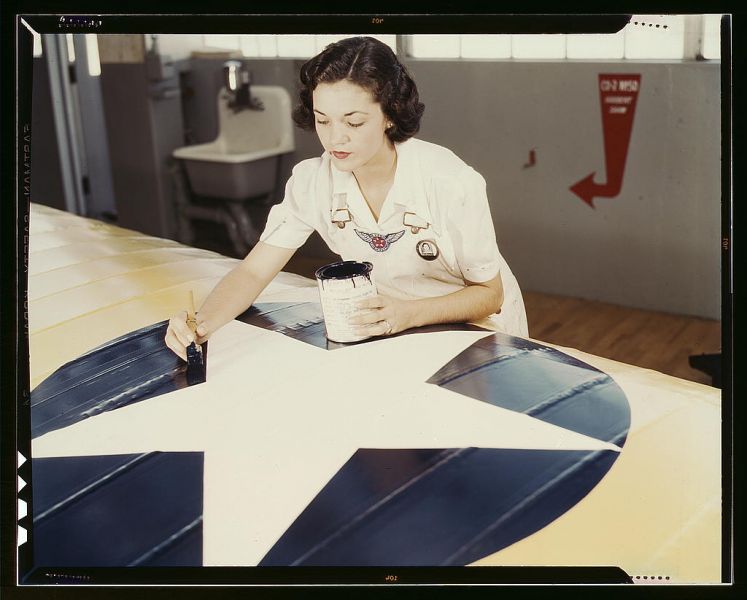 Painting the American insignia on airplane wings is a job that Mrs. Irma Lee McElroy, a former office worker, does with precision and patriotic zeal. Mrs. McElroy is a civil service employee at the naval Air Base, Corpus Christi, Texas. Her husband is a f