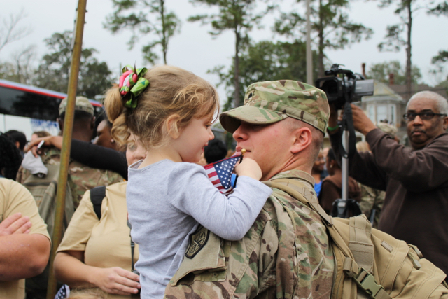 Long awaited hugs at return ceremony by Georgia National Guard / CC BY 2.0 Long awaited hugs at return ceremony