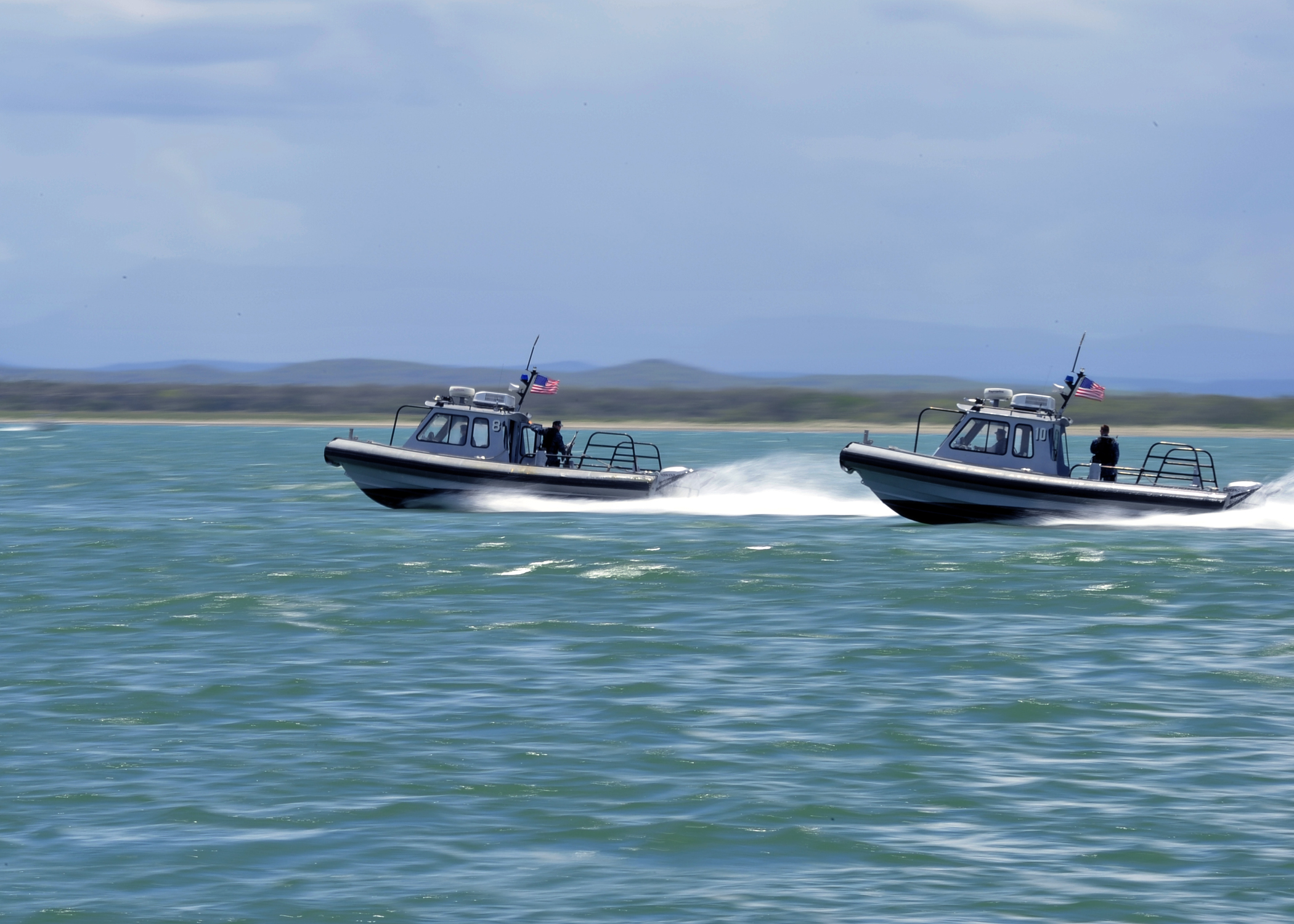 Sailors assigned to the harbor security team at Naval Station Guantanamo Bay, patrol the waters of the base