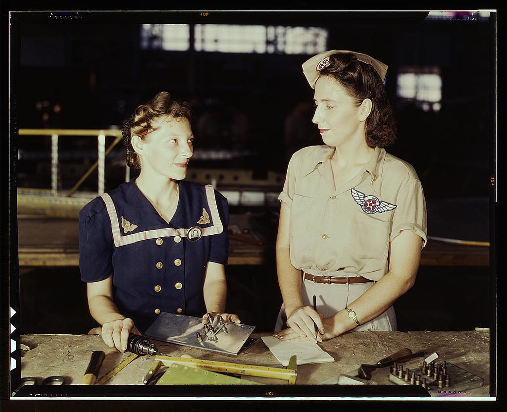 Pearl Harbor widows have gone into war work to carry on the fight with a personal vengeance, Corpus Christi, Texas. Mrs. Virginia Young (right) whose husband was one of the first casualties of World War II, is a supervisor in the Assembly and Repairs Depa