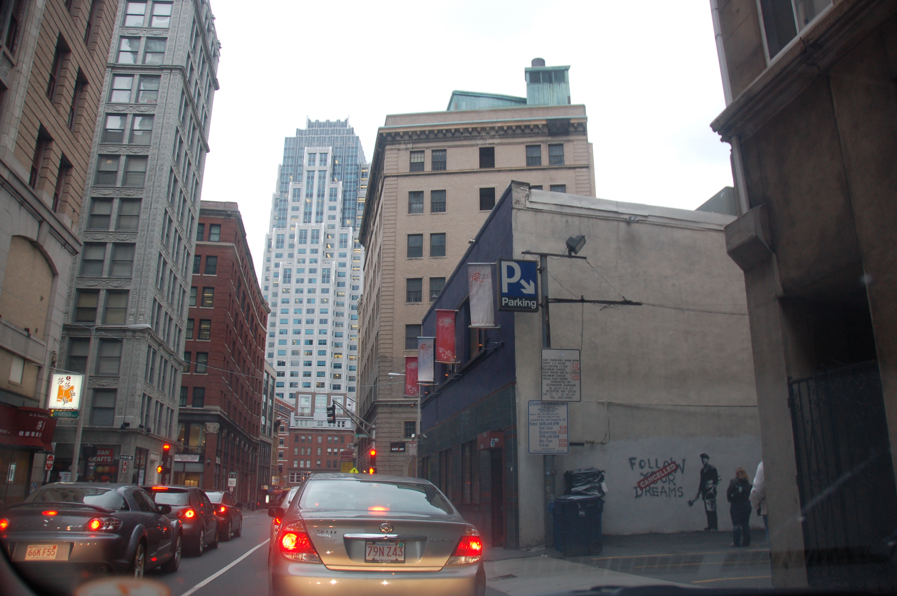 Banksy in Boston: View of F̶O̶L̶L̶O̶W̶ ̶Y̶O̶U̶R̶ ̶D̶R̶E̶A̶M̶S̶ CANCELLED on Essex St, Chinatown, Boston, with rush hour traffic by Chris Devers / CC BY-NC-ND 2.0 Banksy in Boston: View of F̶O̶L̶L̶O̶W̶ ̶Y̶O̶U̶R̶ ̶D̶R̶E̶A̶M̶S̶ CANCELLED on Essex St, Chinatown, Boston, with rush hour traffic