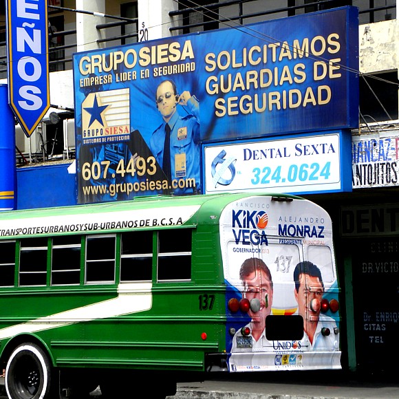 Security guard recruitment sign, political ad on bus, Tijuana by Todd Mecklem / CC BY-NC-ND 2.0 Security guard recruitment sign, political ad on bus, Tijuana